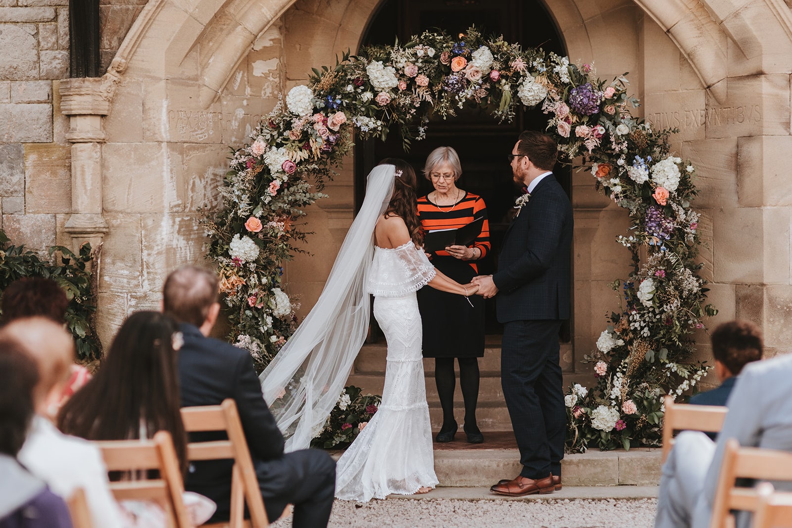 wedding ceremony flower arch backdrop