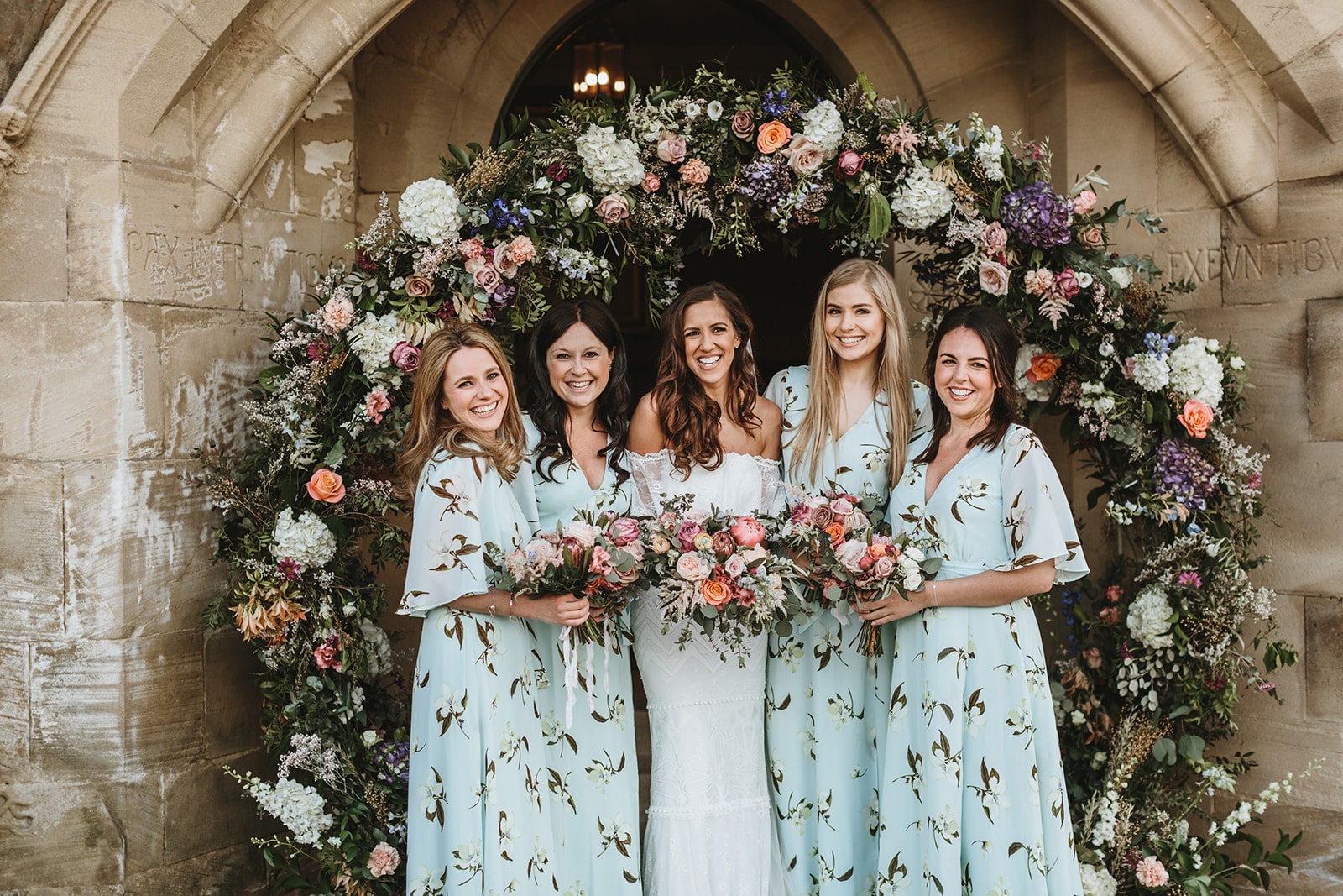 floral arch at a wedding for group shots 