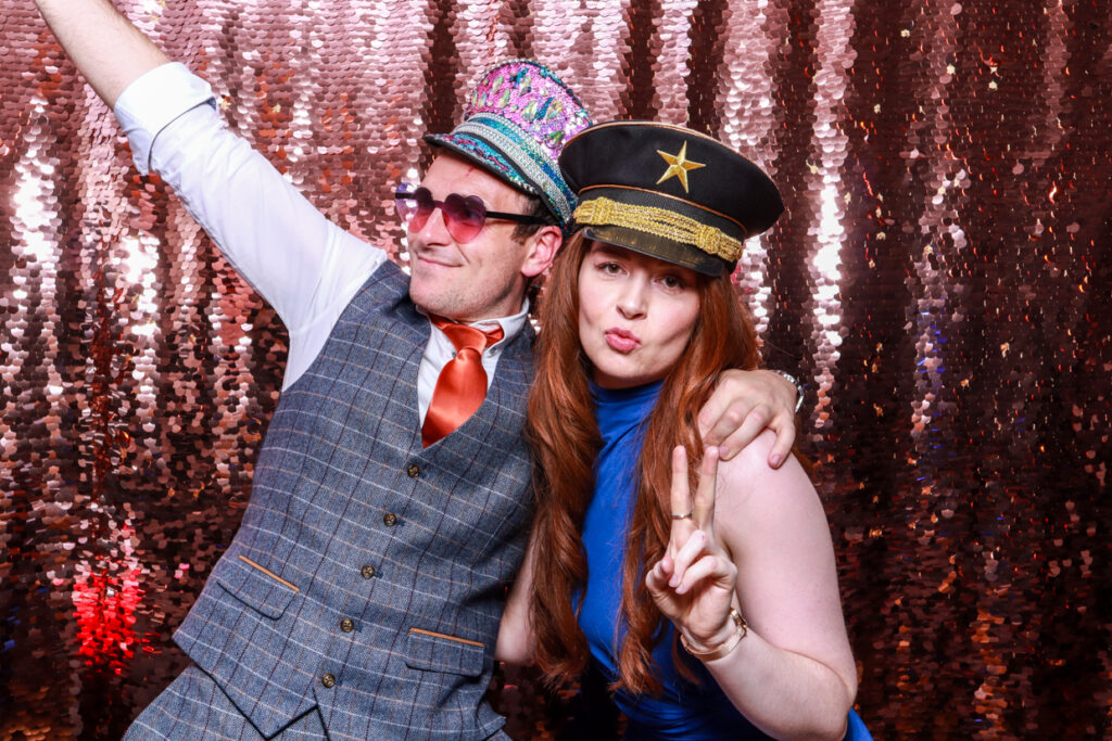 couple posing for a birthday party photo booth hire in the cotswolds