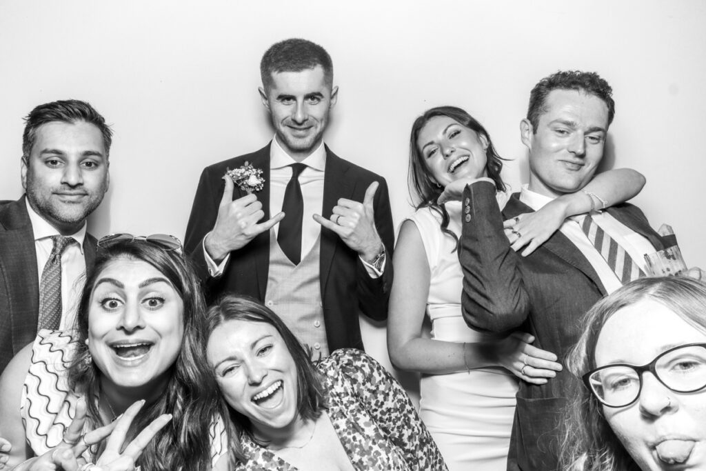 black and white photo of guests having tons of fun during a corporate event party entertainment in gloucestershire