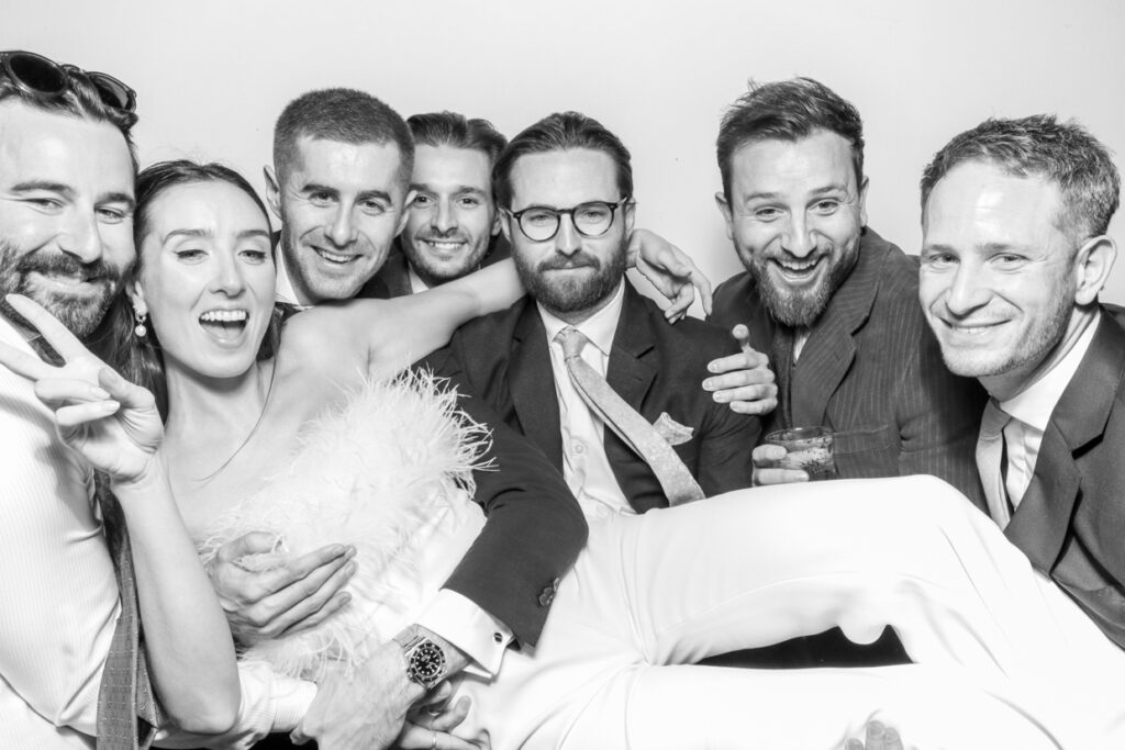 black and white photo of guests having tons of fun during a corporate event party entertainment in gloucestershire