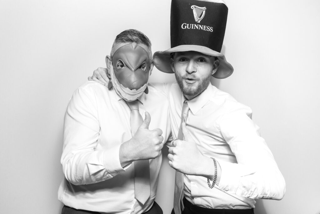 2 guests wearing custom props during a corporate event Gloucester Photo Booth