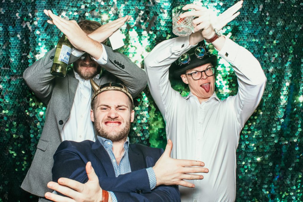 fun group of guys posing during an elmore court wedding photo booth hire