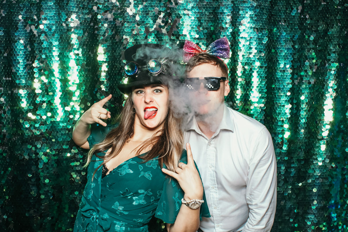 guy smoking during a photo booth pose at elmore court wedding venue in stroud