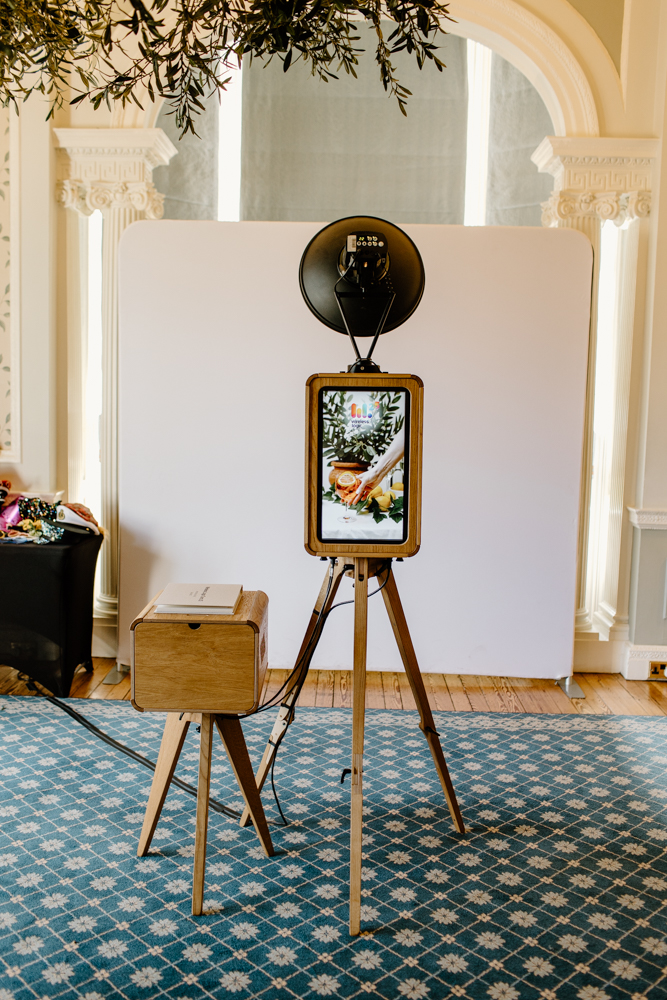 The Icon Photo Booth setup at Hedsor House with wooden frame and modern display with a white backdrop for a kardashian style photo booth