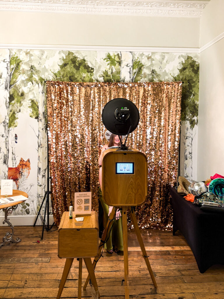 eastington park photo booth setup with blush sequins backdrop and wooden photo booth, by mad hat photo booth
