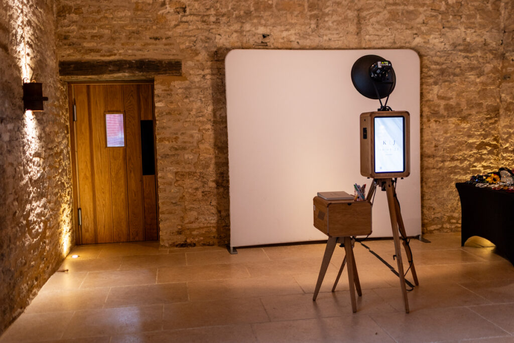 mad hat photo booth setup near the bar area at ivy lodge wedding venue in cirencester