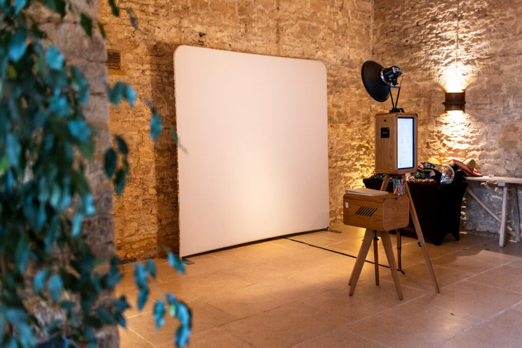 mad hat photo booth setup near the bar area at ivy lodge wedding venue in cirencester