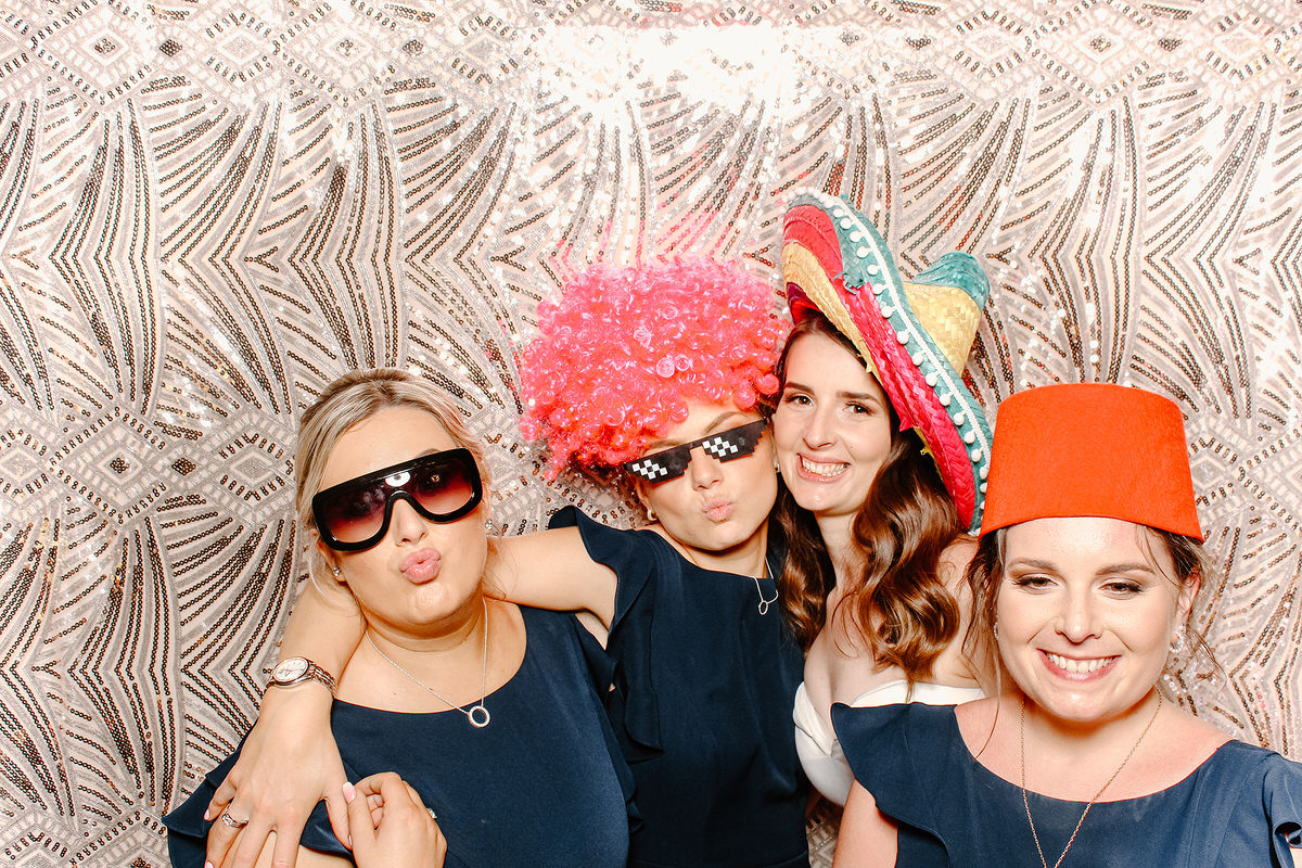 bridesmaids posing with props during wedding reception for bristol photo booth