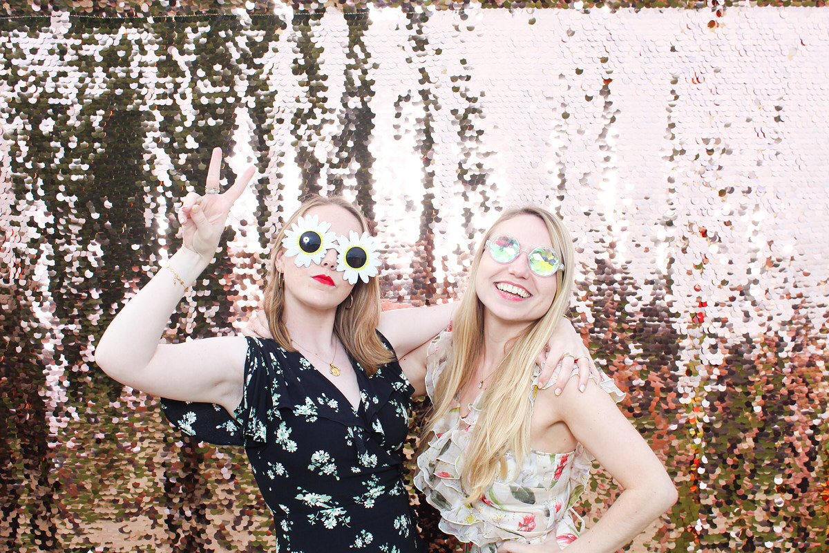 wedding guests posing for mad hat photo booth at lapstone barn cotswolds