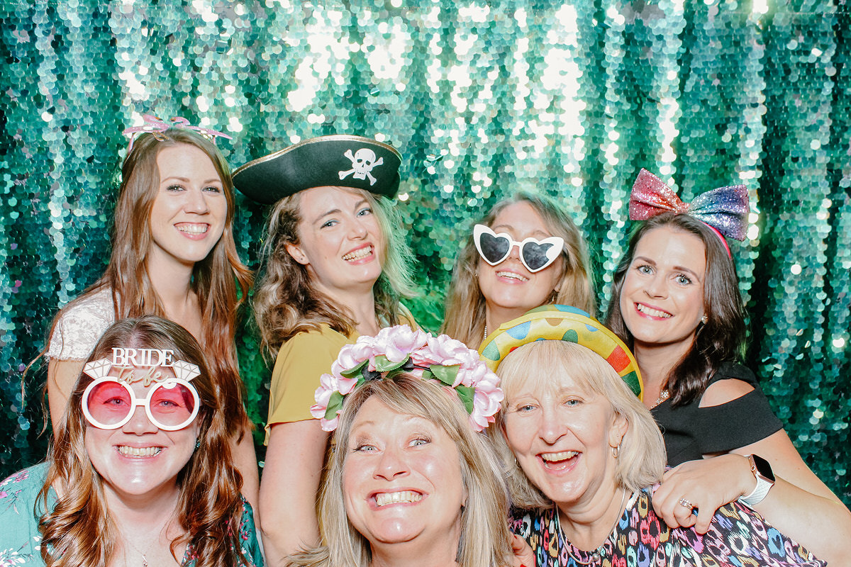 Barn Wedding green sequins backdrop photo booth