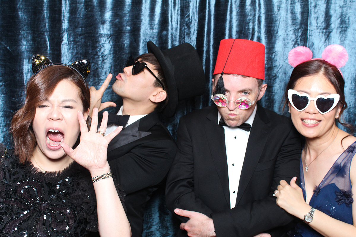 guests posing with hats and glasses during a photo booth wedding at whatley manor 