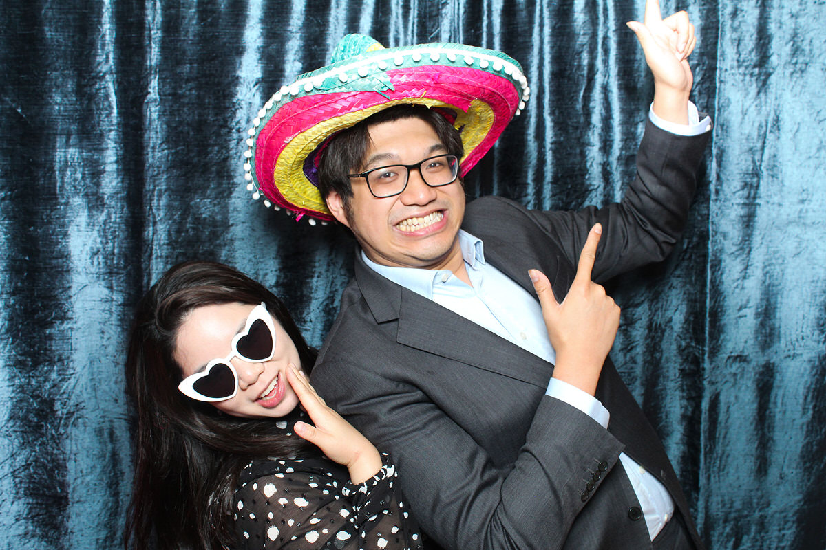 fun couple posing for a cotswolds photo booth during a wedding at whatley manor 
