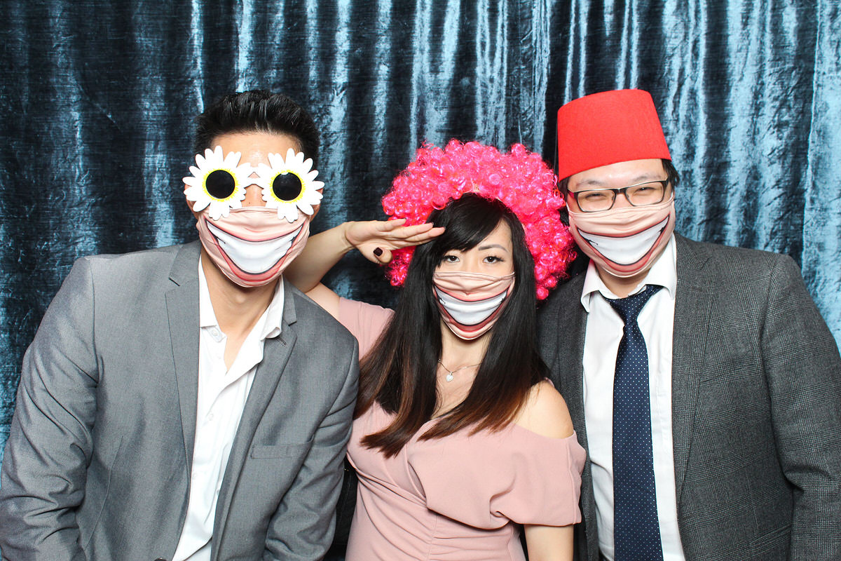 funny guests wearing masks during a photo booth party for a cotswolds wedding