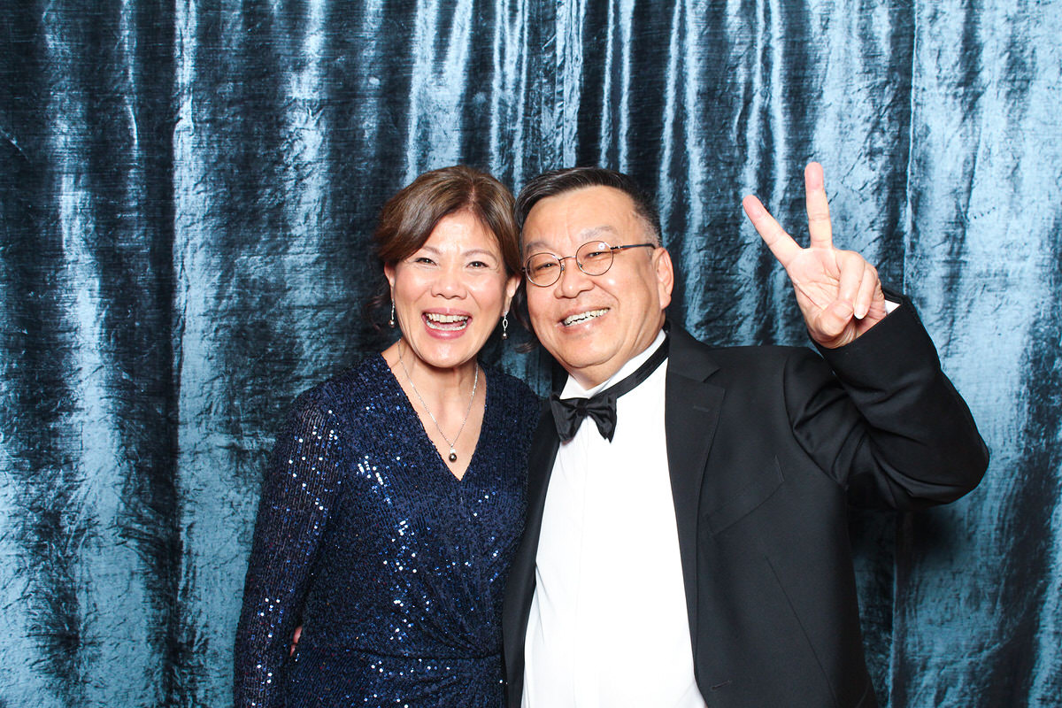 couple posing at whatley manor for a photo booth event