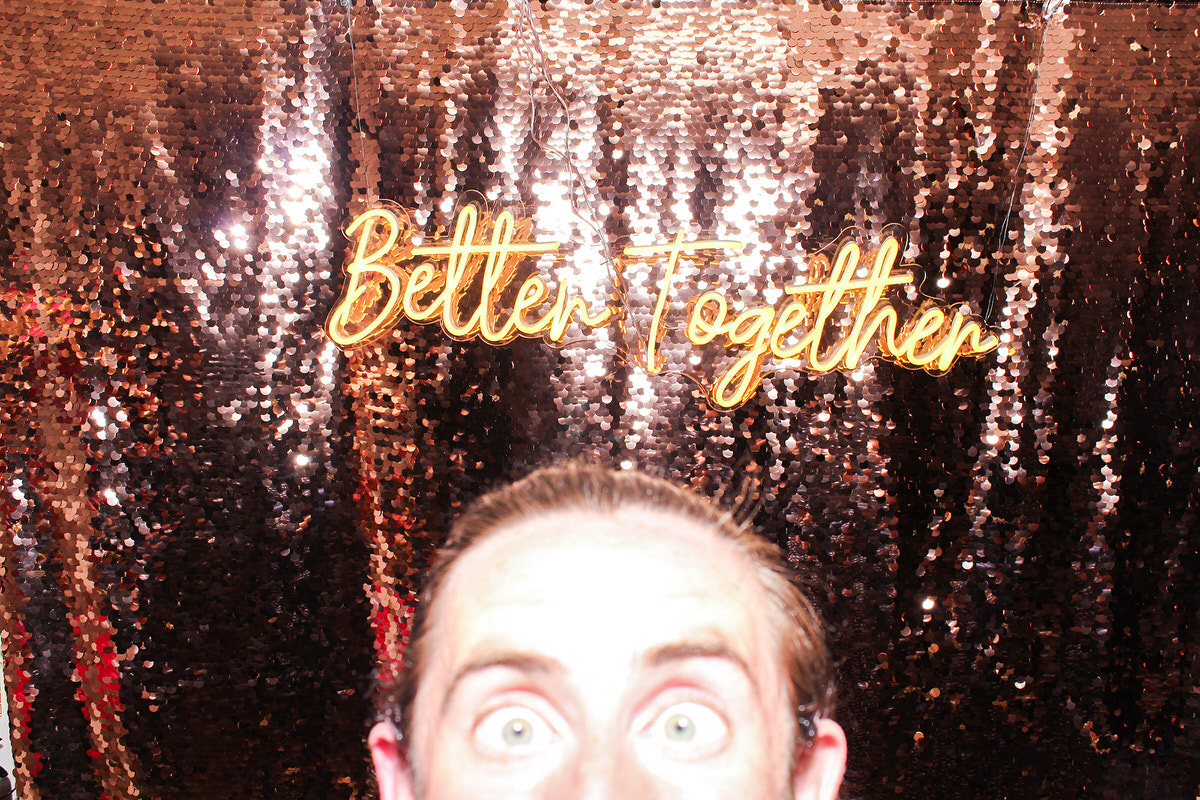 funny guy with the Better Together wedding neon sign for the photo booth party hyde house event 