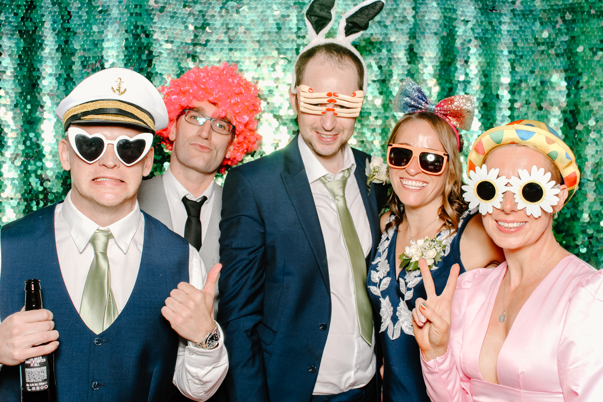 guests wearing fun props during the pendrell hall wedding reception
