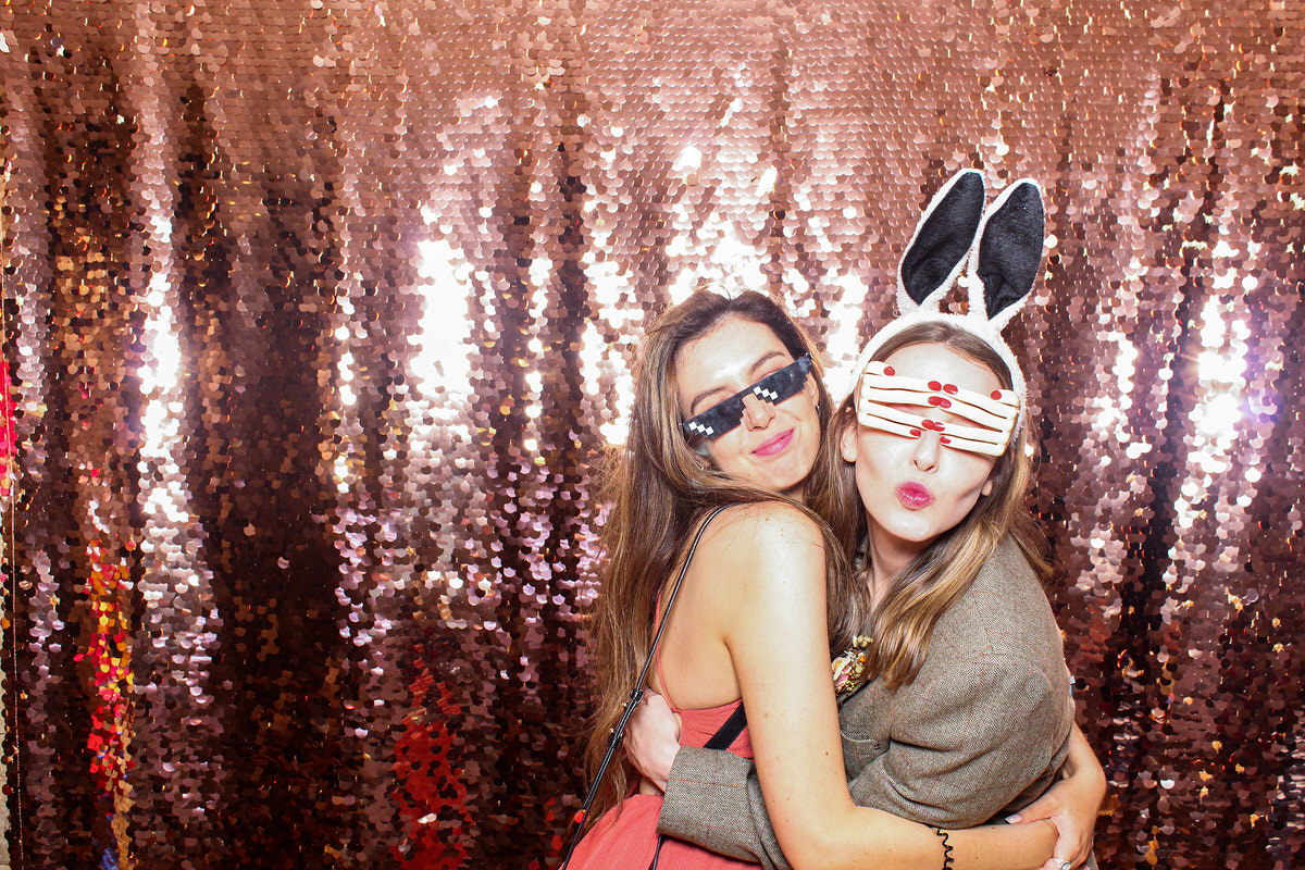 ladies posing for a cotswolds photo booth during a wedding in tetbury