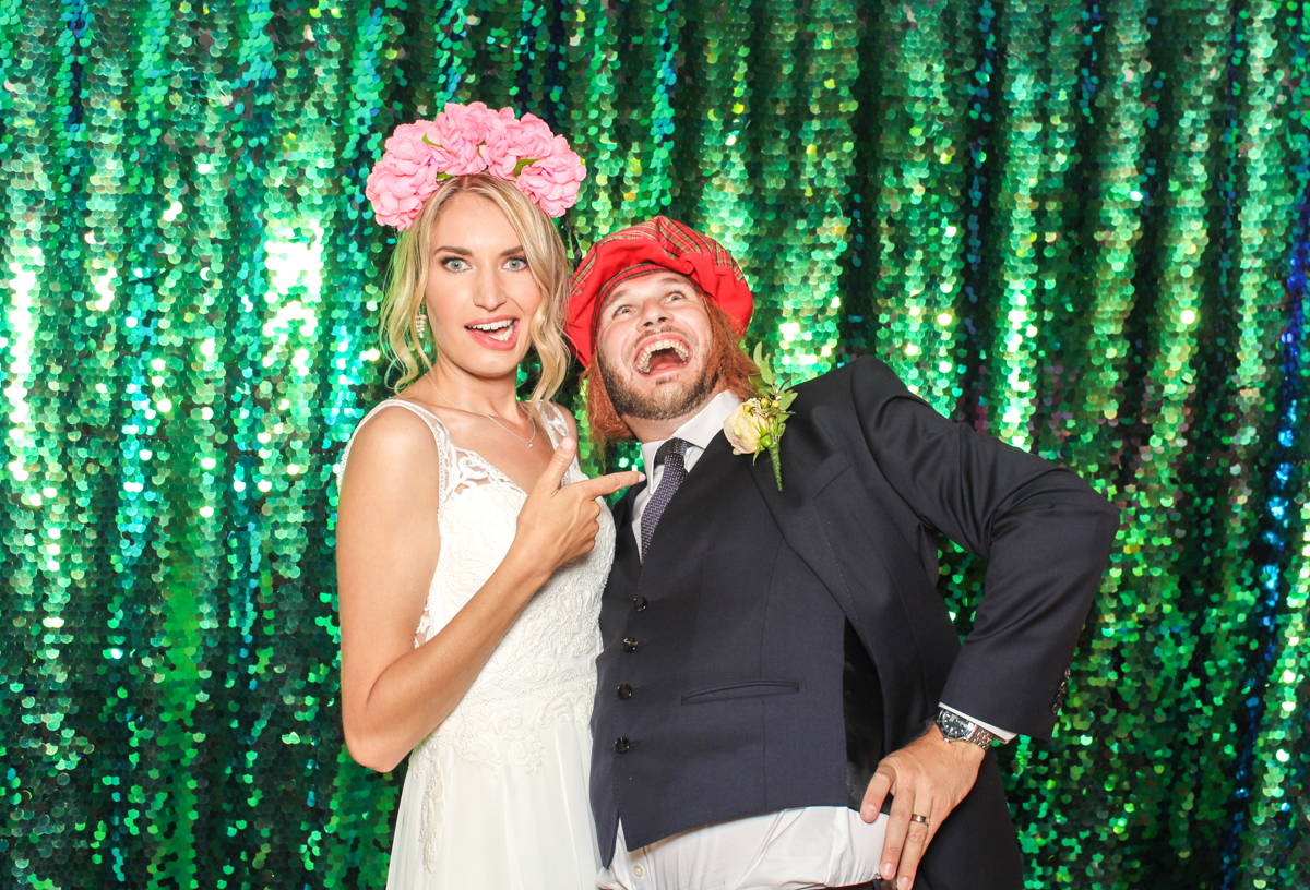 bride and groom during their photo booth pictures by cotswolds based wedding entertainment