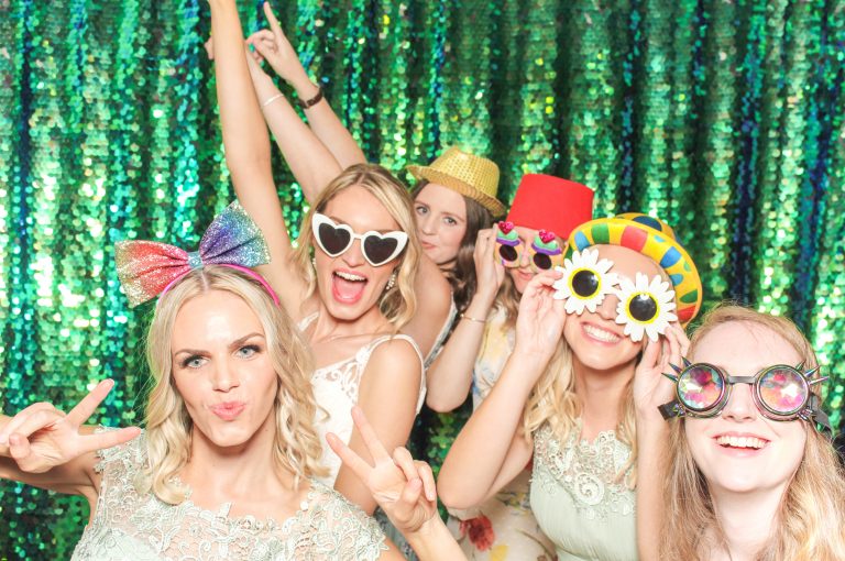 wedding guests posing at cider mill barn for a wedding photo booth entertainment