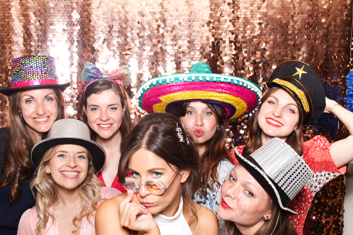 girls posing for mad hat photo booth wedding entertainment cotswolds