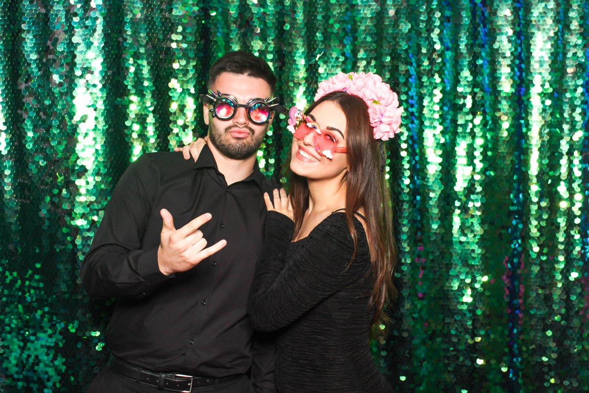 couple posing with the green sequins backdrop for our cotswolds photo booth at Stourport Manor Hotel wedding