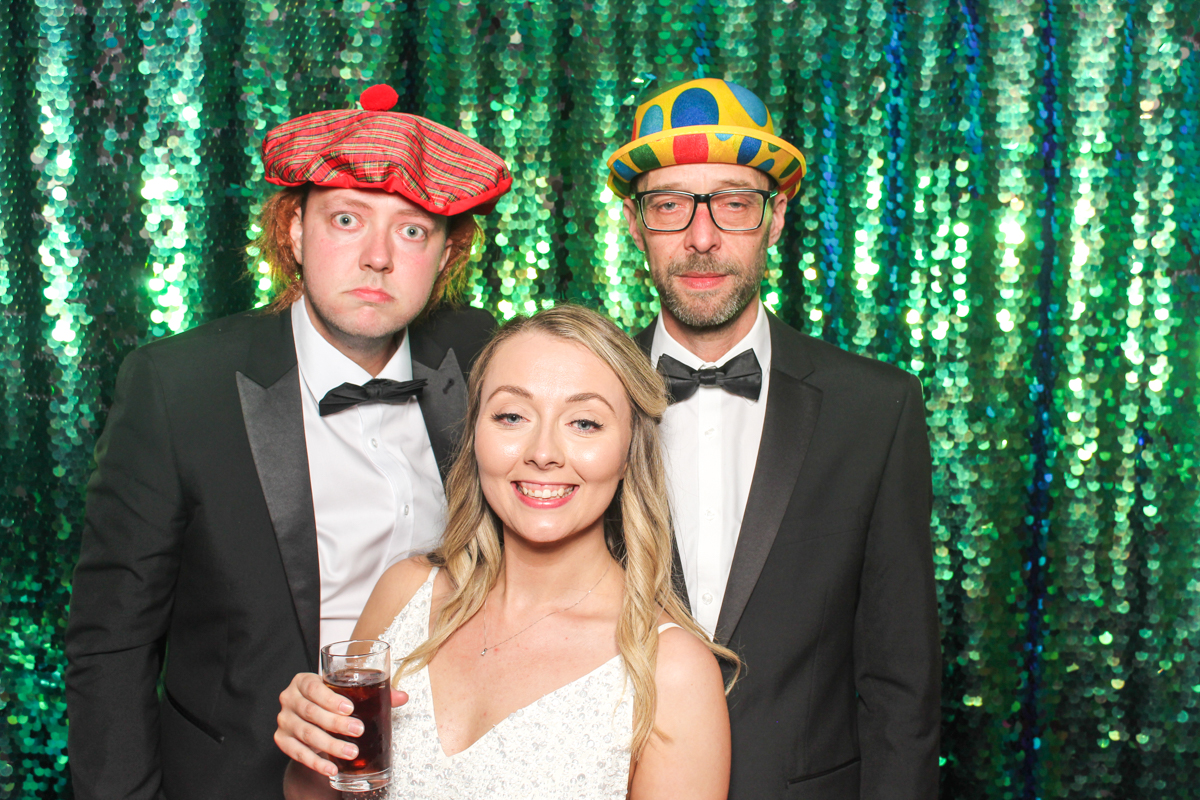 green sequins backdrop for a fun photo booth at  Hotel wedding