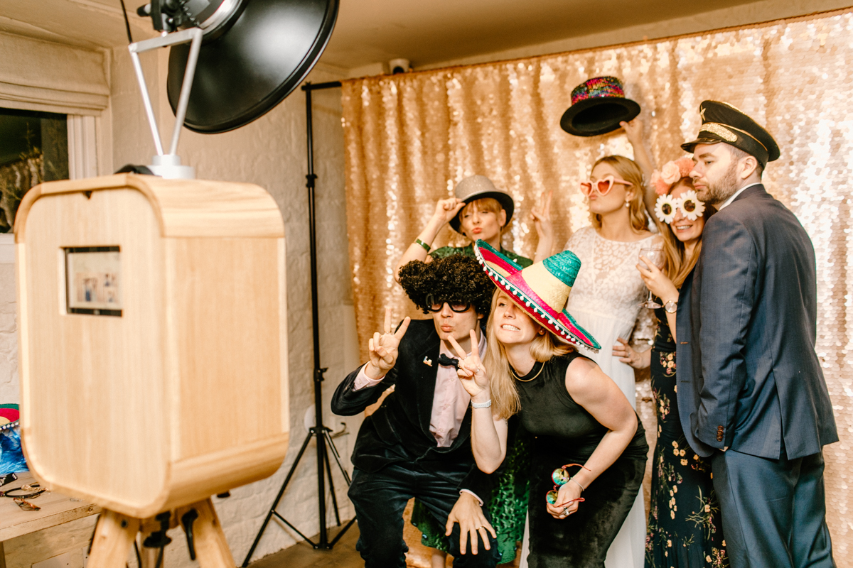 behind the scenes wedding with wooden photo booth cotswolds