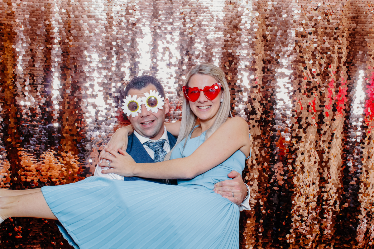 yard space photo booth hire with guests posing during evening entertainment 