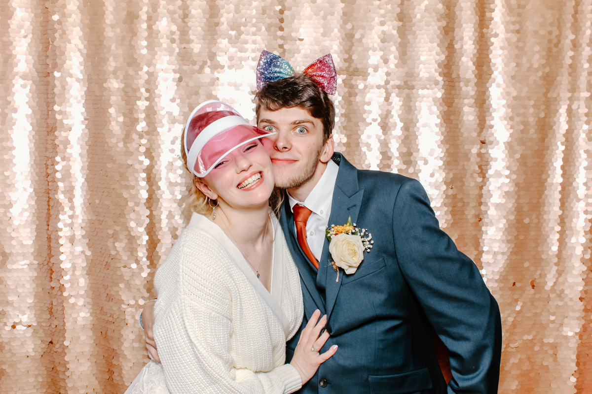 bride and groom having photo booth photos during their wedding in Gloucestershire