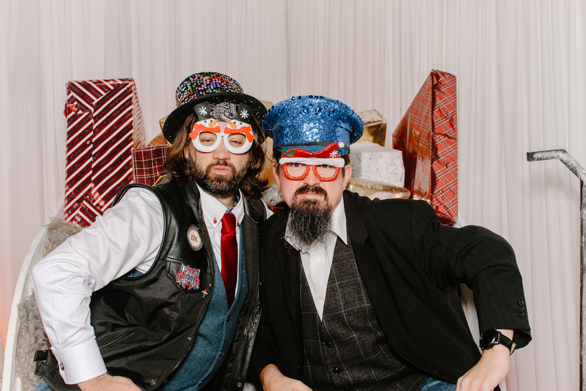 guests posing for a photo booth hire cotswolds