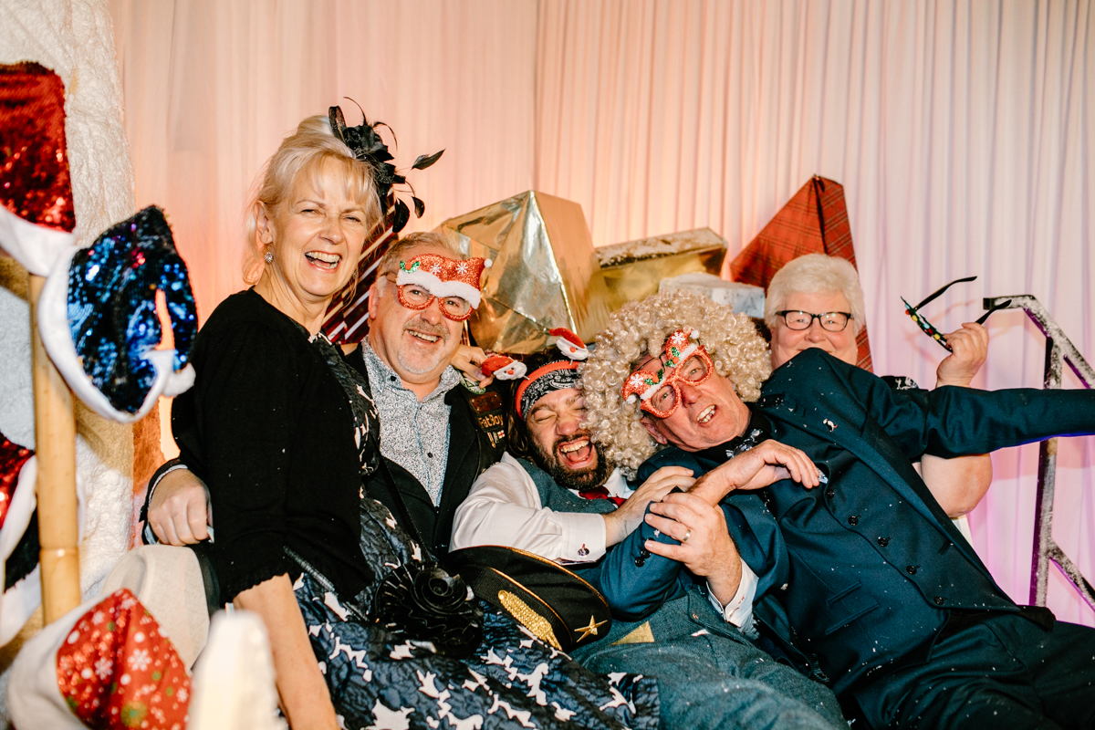 behind the scenes during a photo booth entertainment for a christmas themed wedding