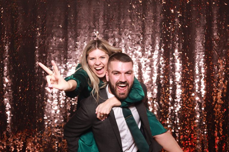 couple having fun and posing for a cripps barn wedding during the party entertainment