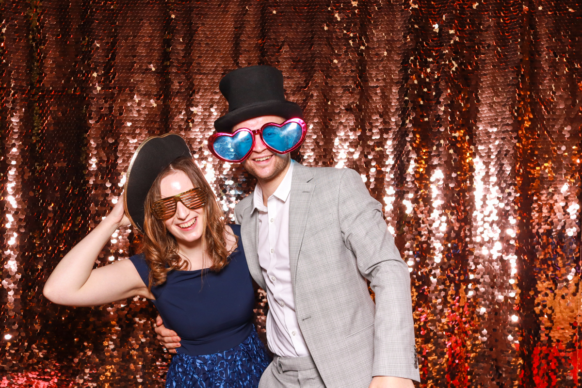 rose gold sequins backdrop for cripps barn wedding in cotswolds