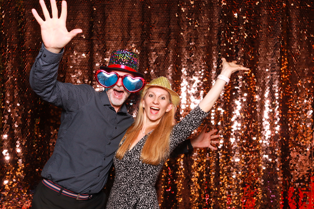 fun couple waving their hand during a wedding party at cripps barn