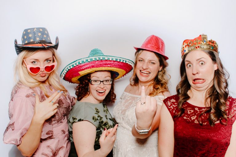 fun guests posing for a cotswolds photo booth hire at the swan hotel cotswolds