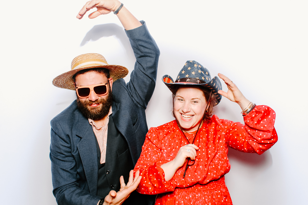 funny guests posing for cotswolds based photo booth bibury