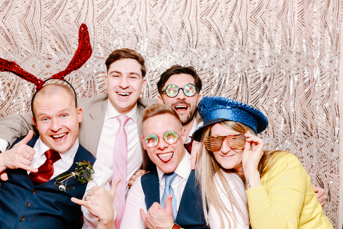 guests using the photo booth during a Cotswold house wedding
