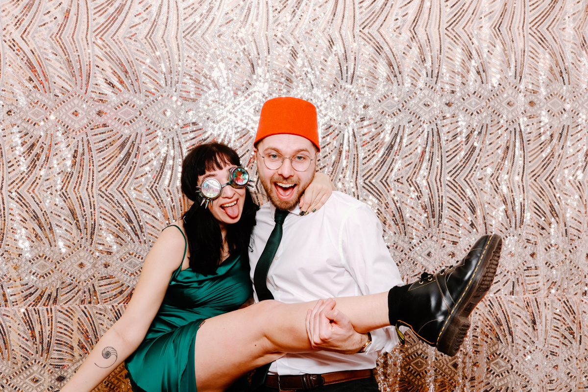 guests with sequins backdrop during a Cotswold house photo booth hire