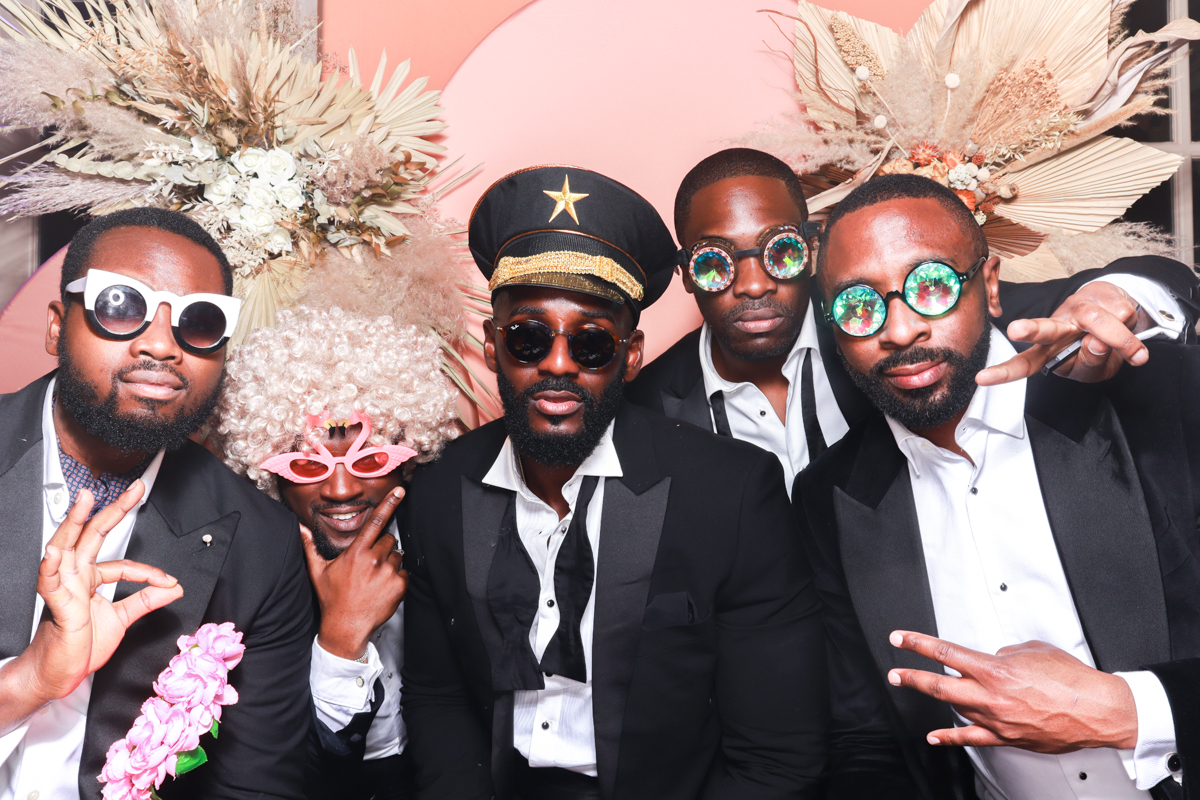 group of guys posing with props during the party at euridge manor wedding venue