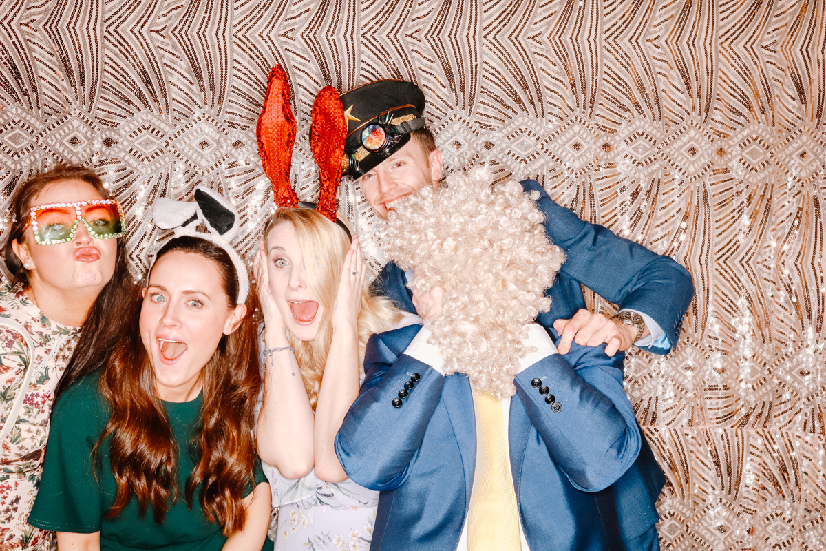 guests being silly during a photo booth event at old gore by yard space wedding