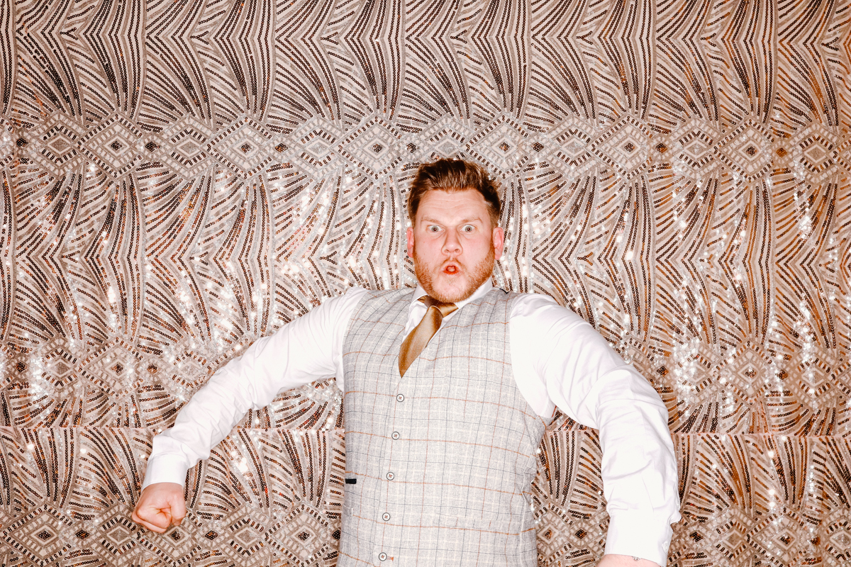 guy posing during a wedding party photo booth entertainment old gore