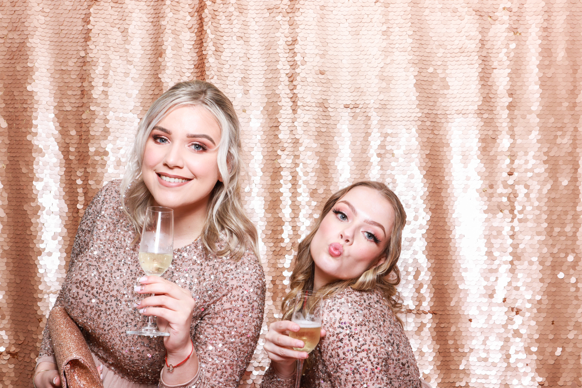 bridesmaids posing with drinks for a photo booth 