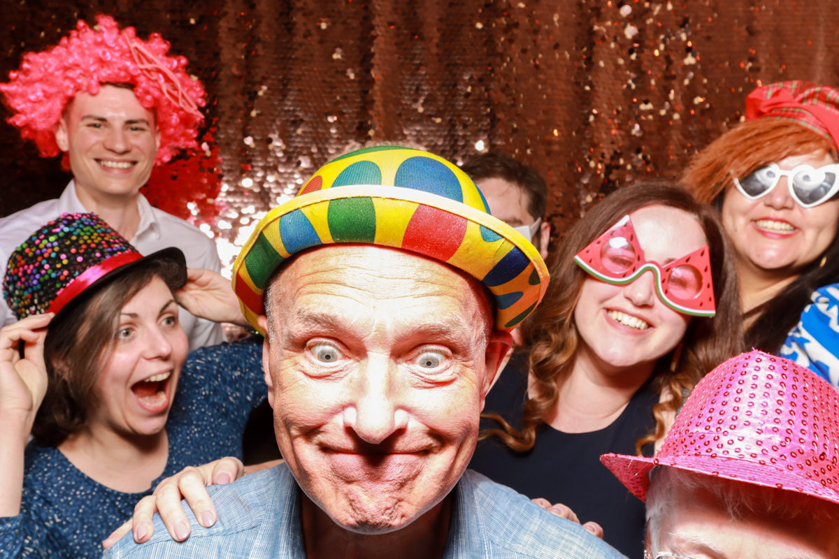 guests using a fun photo booth for their barn wedding worcestershire