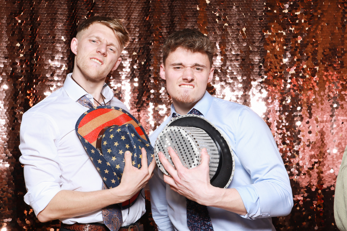 guys posing with hats for a wedding at old gore by yard space events