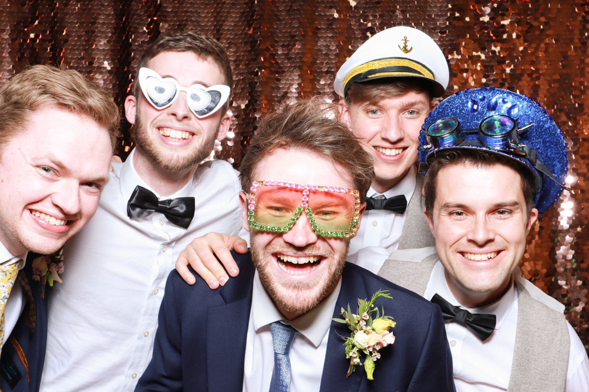guys having fun posing for the cotswolds photo booth