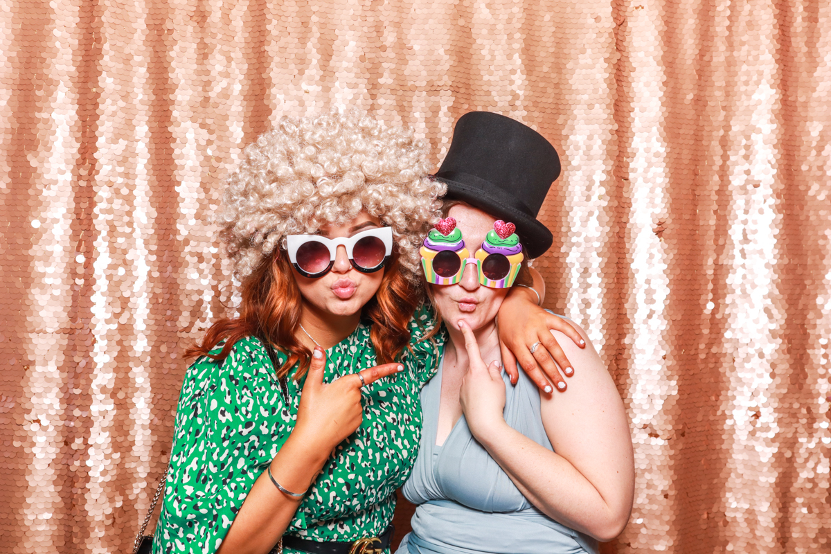 glam photo booth with blush sequins backdrop