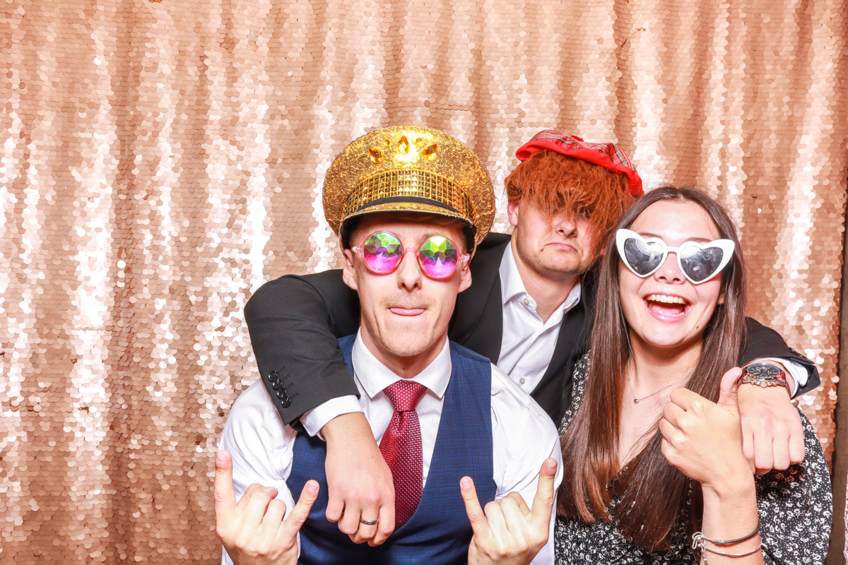 fun snaps of guests with wigs and props during a photo booth party entertainment 