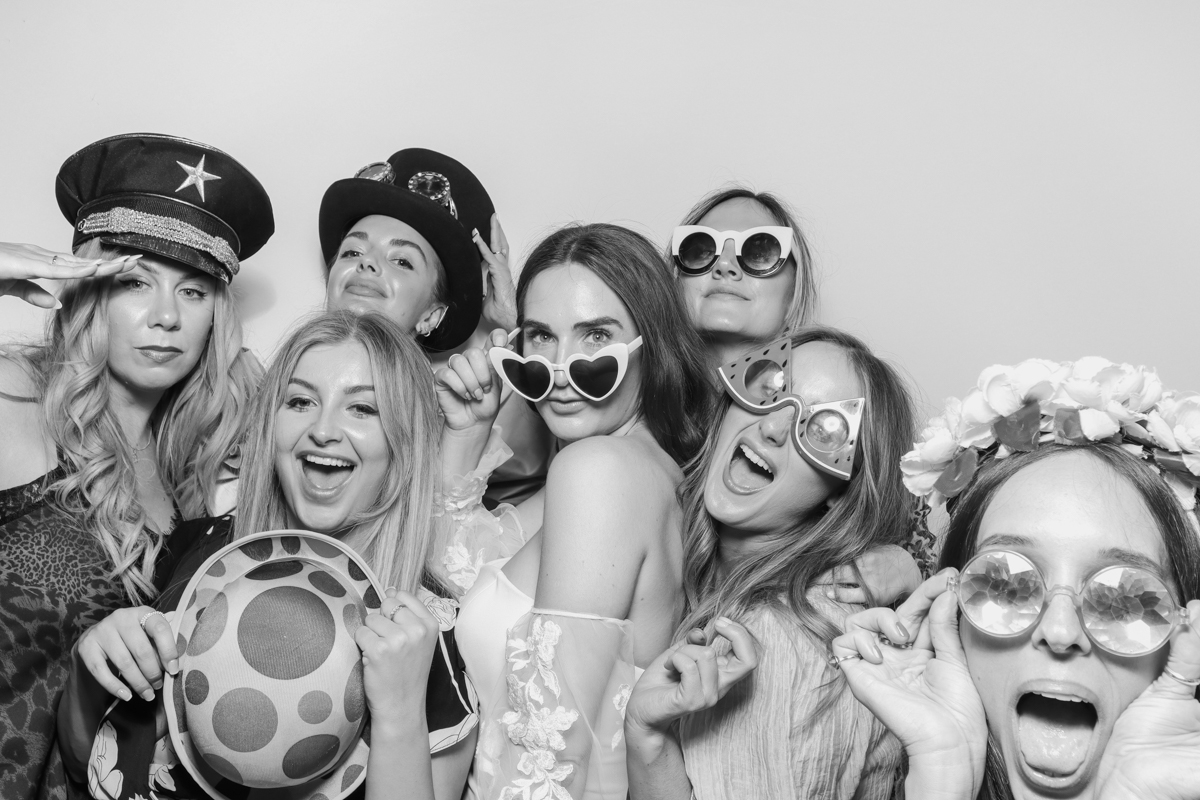 bride and bridesmaids during a photo booth wedding in Cotswolds old gore by yard space
