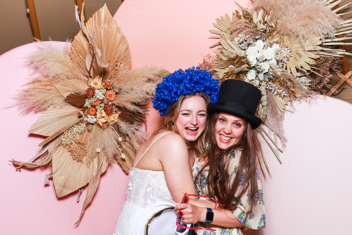 dried flowers and pink arches backdrop at thorpe gardens wedding venue